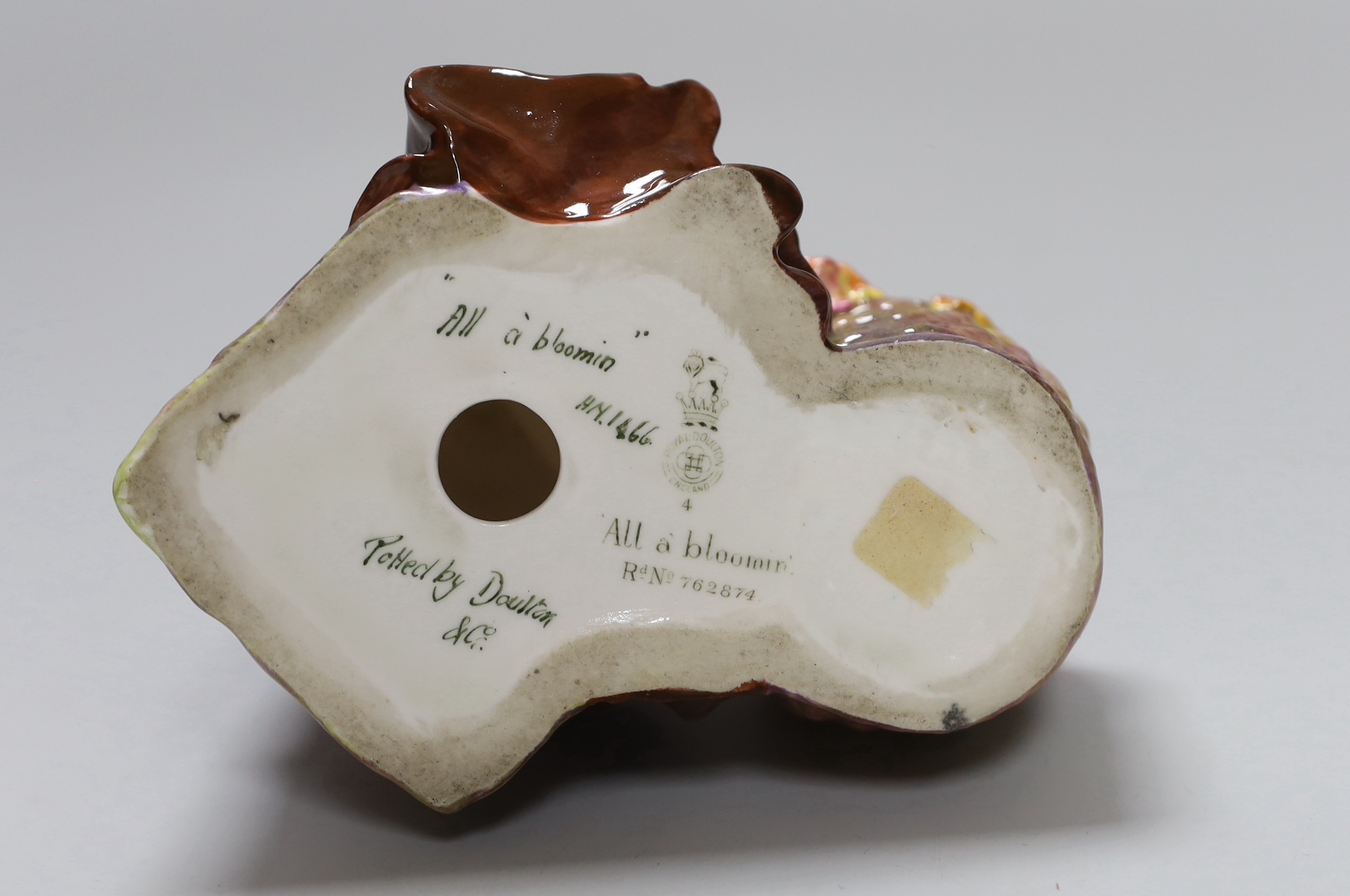 A Royal Doulton figure, 'All a bloomin', HN1466, 16cm